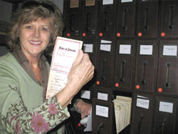 Butte County Clerk-Recorder Candace Grubbs holds up an old power-of-attorney form. For the past 15 years, she has tried to get the county to establish a hall of records for its thousands of historic documents. Currently they are being stored in several sites—most lacking climate controls—and are largely inaccessible to the public. PHOTO BY GINGER MCGUIRE