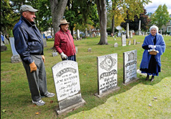 Photo by Deb Jacques Dave and Bruce Randall of Birmingham listen to Pat Andrews, a Birmingham resident since 1943, speak about local historical figures during a special “Pioneer Tour” tour of Birmingham’s Greenwood Cemetery Oct. 17. 