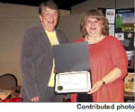 Elizabeth Sherrill, right, president of the N.C. Society of Historians, presents to Doris Worthington, a Rocky Mount native and editor of 'The Ties that Bind ... The John E. Todd and Rosa Lee Matthews Story,’ an award for the family history book at a recent annual meeting of the society. The Todd and Matthews families are natives of Nash County. The descendants of John and Rosa Todd held a family reunion at Mt. Zion Church in June 2009.