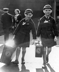 Oct. 6 1950 b/w file photo of 10 year old twins Brian Thomas Sullivan (left) and Kevin James Sullivan from Islington, London, who carry their luggage to the boat train "Rangitoto" as they leave Liverpool Street station in London bound for Auckland, New Zealand. Britain and Australia are saying sorry to thousands of British children who were promised a better life overseas, only to suffer abuse and neglect thousands of miles from home. The British government said Sunday that Prime Minister Gordon Brown will apologize for 20th-century child migrant programs that saw thousands of poor British children sent to Australia, Canada and other former colonies until the 1960s. Many ended up in institutions or were sent to work as farm laborers.