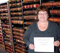 Bolivar Free Press Staff Photo - by Charlotte Marsch - Polk County Genealogical Society secretary and archivist Leta Gass shows a sample of what the First Families of Polk County certificates look like. She has completed documentation for recognition in the Found Families, 1836-1860, category. The project is being launched in honor of the 175th anniversary of the creation of Polk County to recognize families with roots in Polk County.