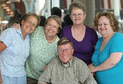 Siblings Anne Pocock, left, of Bergen; Joanne Eckert of East Rochester; Ruth Kowacich of Henrietta; Marijayne Schaumloeffel of Red Creek; and Edward Vincent of Greece pose at The Mall at Greece Ridge on Monday. Some had been separated for decades before reuniting. Photo by Jen Rynda - Democrat & Chronicle staff photographer)