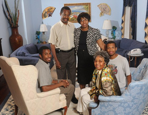 Family: Pictured in 2008, Carson poses in his home with his wife, Lacena 'Candy' Rustin, his two sons and his mother, Sonya Carson (seated at right) – who is actually legally named Johnnie.