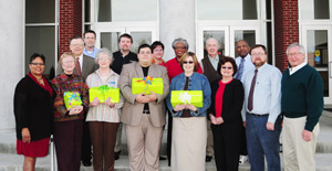 Greater Campbellsville United presented CDs of 32 oral history interviews with Taylor and Green County African-American to local libraries and historical sites at a meeting March 9 at the Ransdell Chapel on the Campbellsville University Campus. From left are: Front row - Wanda Washington, coordinator of Greater Campbellsville United; Betty Jane Gorin-Smith, local historian, Heistand House; Elaine Munday, librarian, Taylor County Public Library; John Burch, director of Campbellsville University's Montgomery Library; Shelley Pruitt, librarian, Green County Public Library; Campbellsville Mayor Brenda Allen; Jon Allen, who performed the interviews; and Taylor County Judge/Executive Eddie Rogers. Second row - John Chowning, chair of Greater Campbellsville United; Ron McMahan (behind Chowning), executive director, Campbellsville-Taylor County Economic Development Authority; Tim Hooper, Montgomery Library archivist; Donna Logsdon, coordinator, Downtown Development; Yevette Haskins, co-chair of Greater Campbellsville United and one of those interviewed; Dr. Robert S. Clark, director of missions for the Taylor County Baptist Association and secretary of Greater Campbellsville United, and the Rev. Michael Caldwell, pastor of Pleasant Union Baptist Church and Greater Campbellsville United board member. (Campbellsville University Photo by Joan C. McKinney)
