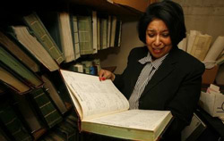 Sheryl Riggs, managing director of the Dale-Riggs Funeral Home at Nebraska and City Park avenues, aims to make its voluminous records more accessible to genealogists.  From The Blade. Photo by Andy Morrison